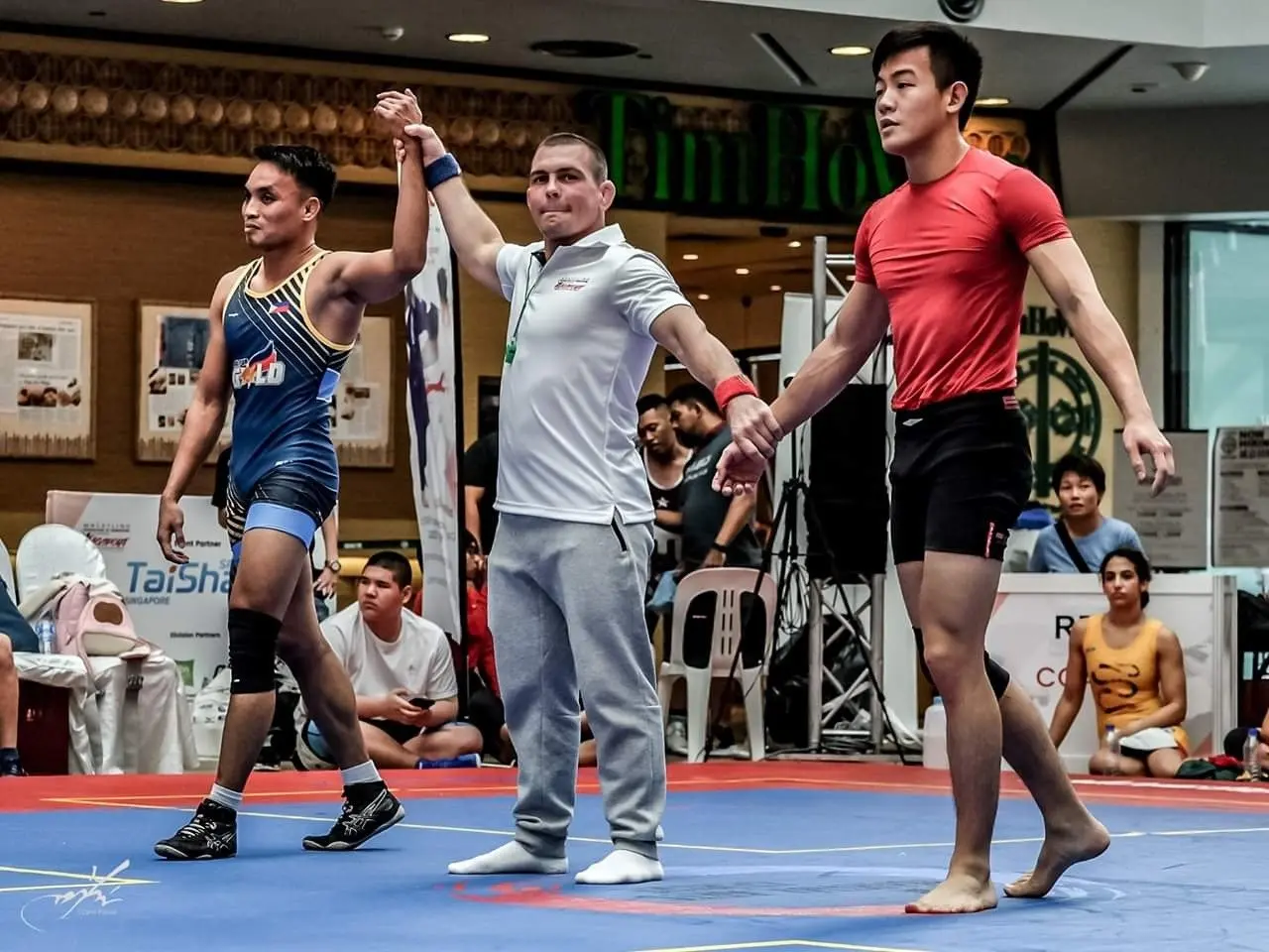 Wrestling competition - hand raised after a win at MKA